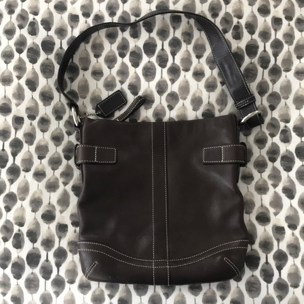 Authentic Coach brown leather saddle bag.